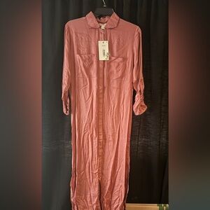 Color: dusty rose; It is long sleeve with an option to button up the sleeves.